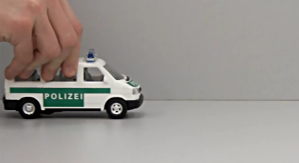 Motion of a flywheel toy car