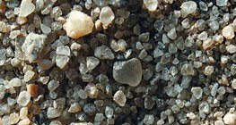 Sand, durch Vergrößerungsglas betrachtet