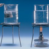 An immersion heater boils water faster than an alcohol burner