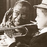 Louis Armstrong, the great jazz trumpeter with one of his students