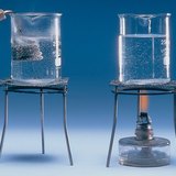 The energy loss is smaller for an immersion heater than for an open flame